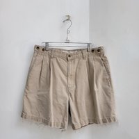 1980 Dockers distressed pleated khaki shorts, size 34