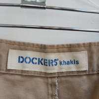 1980 Dockers distressed pleated khaki shorts, size 34