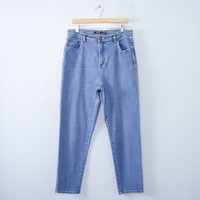 Vintage 90's light blue denim high waisted mom jeans with tapered leg, women's size 16