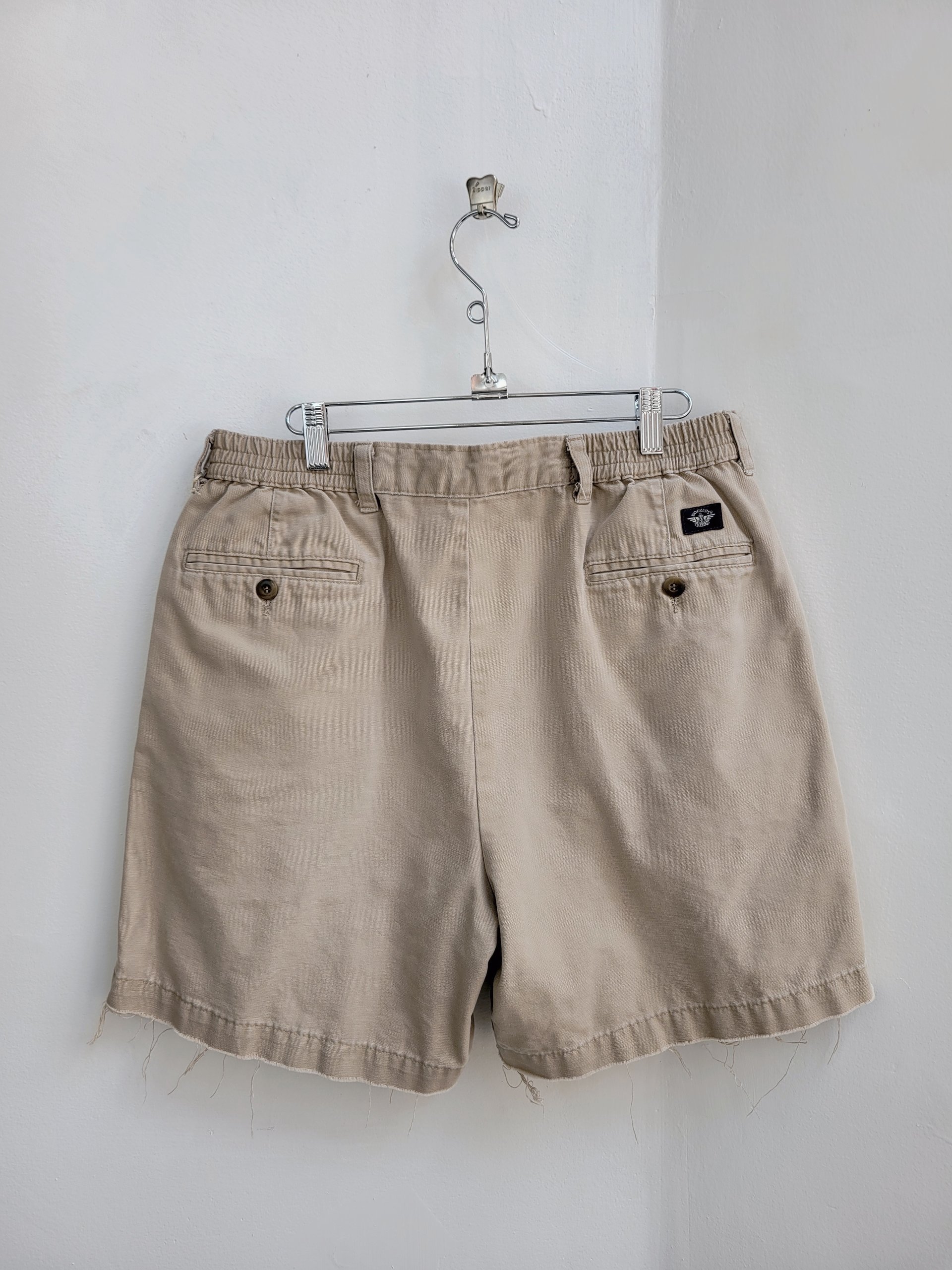 1980 Dockers distressed pleated khaki shorts, size 34