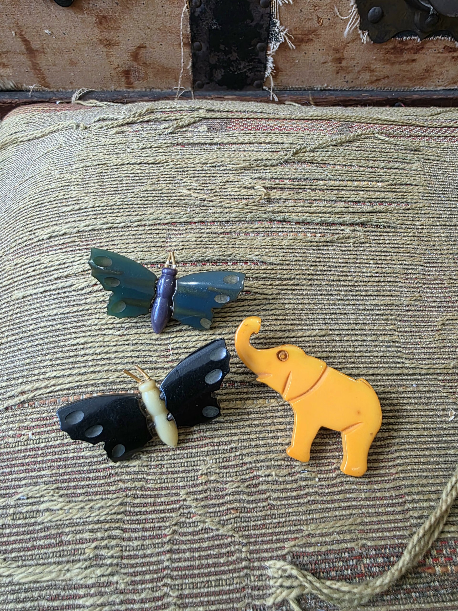 Bakelite butterfly and elephant pins, choose one
