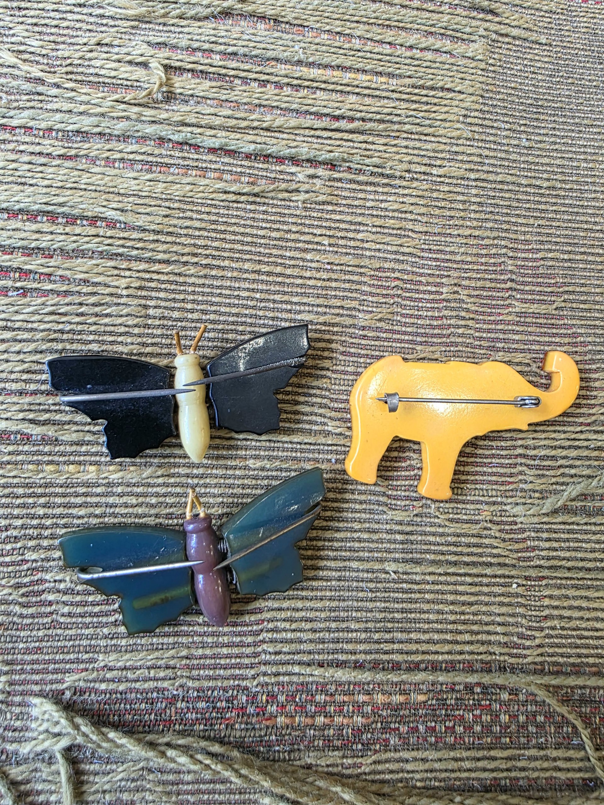 Bakelite butterfly and elephant pins, choose one