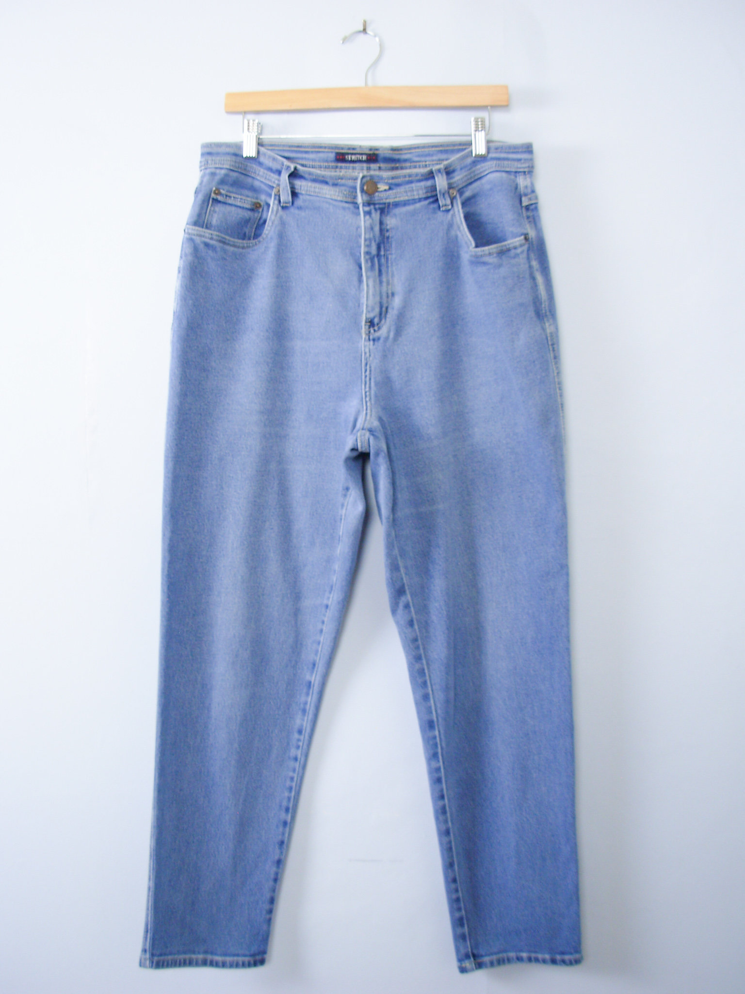 Vintage 90's light blue denim high waisted mom jeans with tapered leg, women's size 16
