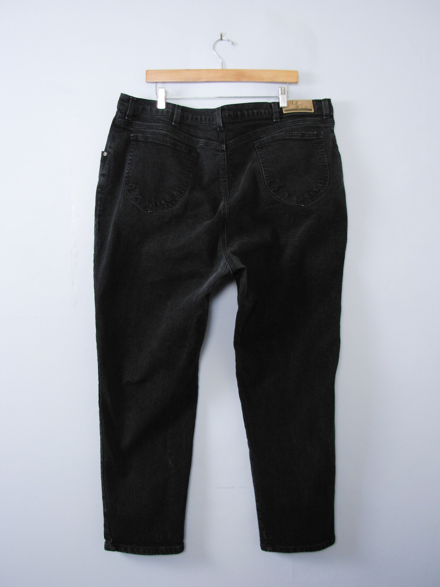 Vintage 90's high waisted black jeans with tapered leg, plus sized women's size 24 / 22