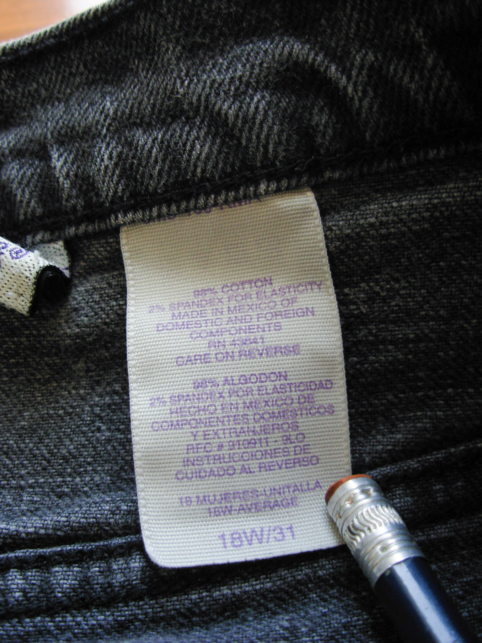 90's high waisted black stretch jeans with tapered leg, women's size 16 / 18