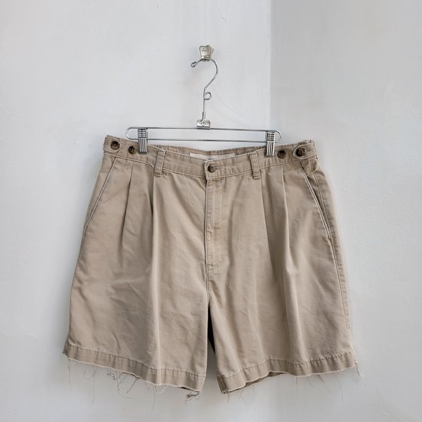 1980 Dockers distressed pleated khaki shorts, size 34